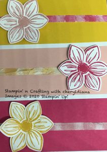 Close up of stamped ribbons on front of card