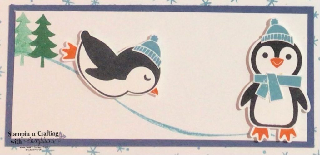 Photograph of penguins enjoying the snow from the Penguin Place Sale-a-Bration Sampler