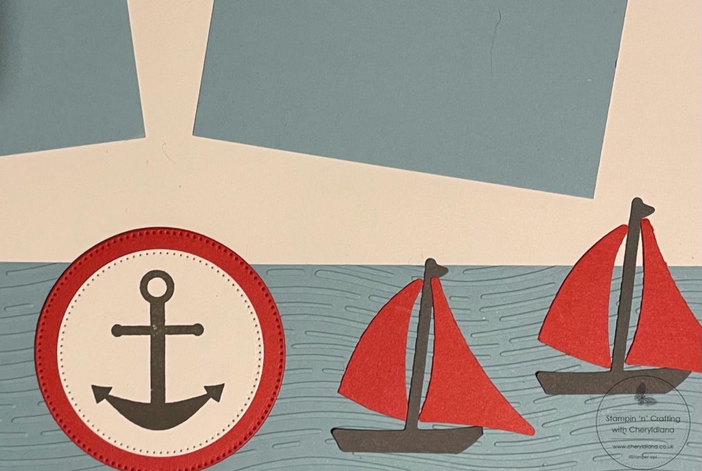 Photograph showing punch art boats for my Scrapbook Layout using embossing folders and punches.